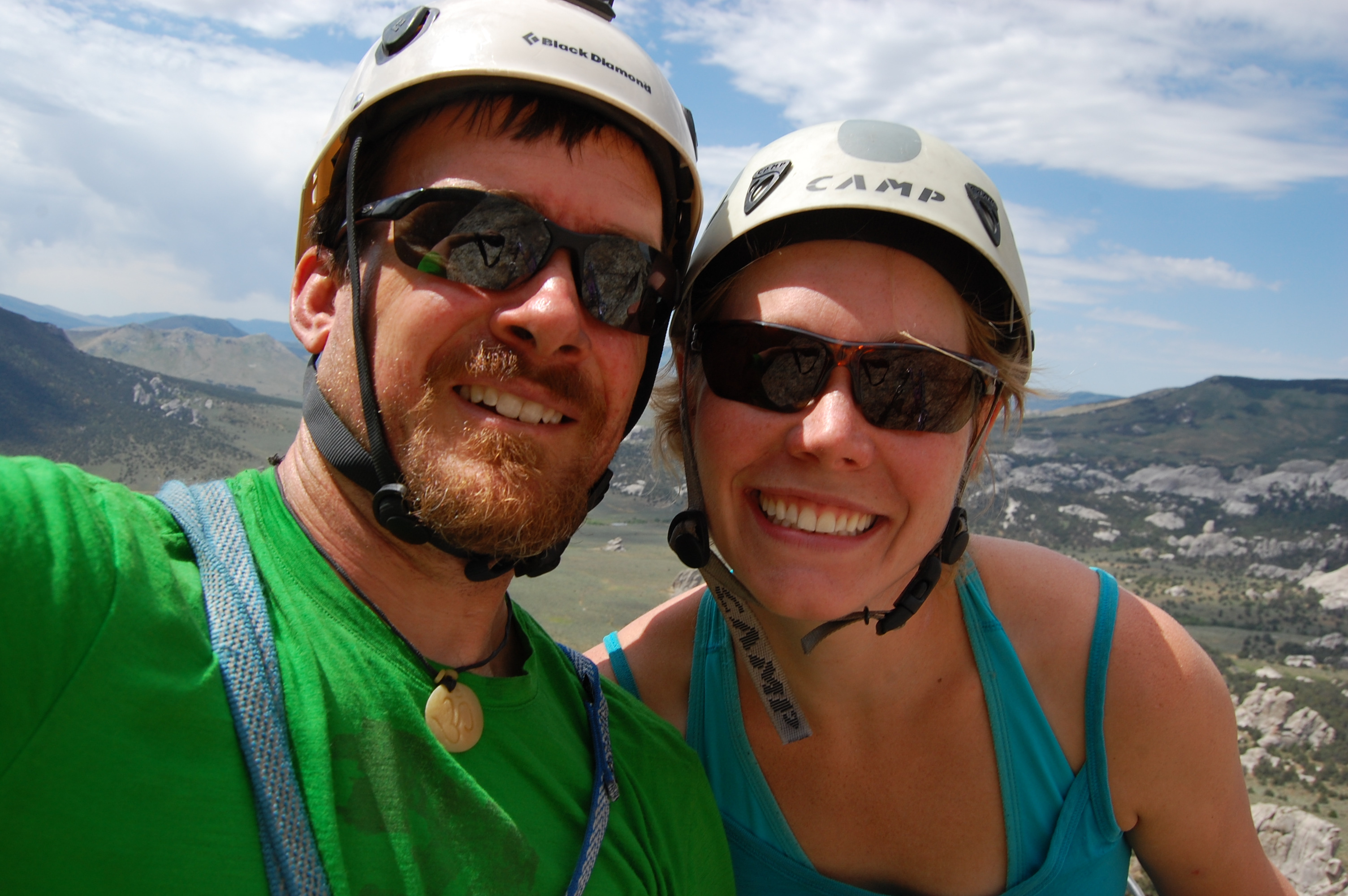 Jon and Rudie summit selfie, helmets on, big smiles