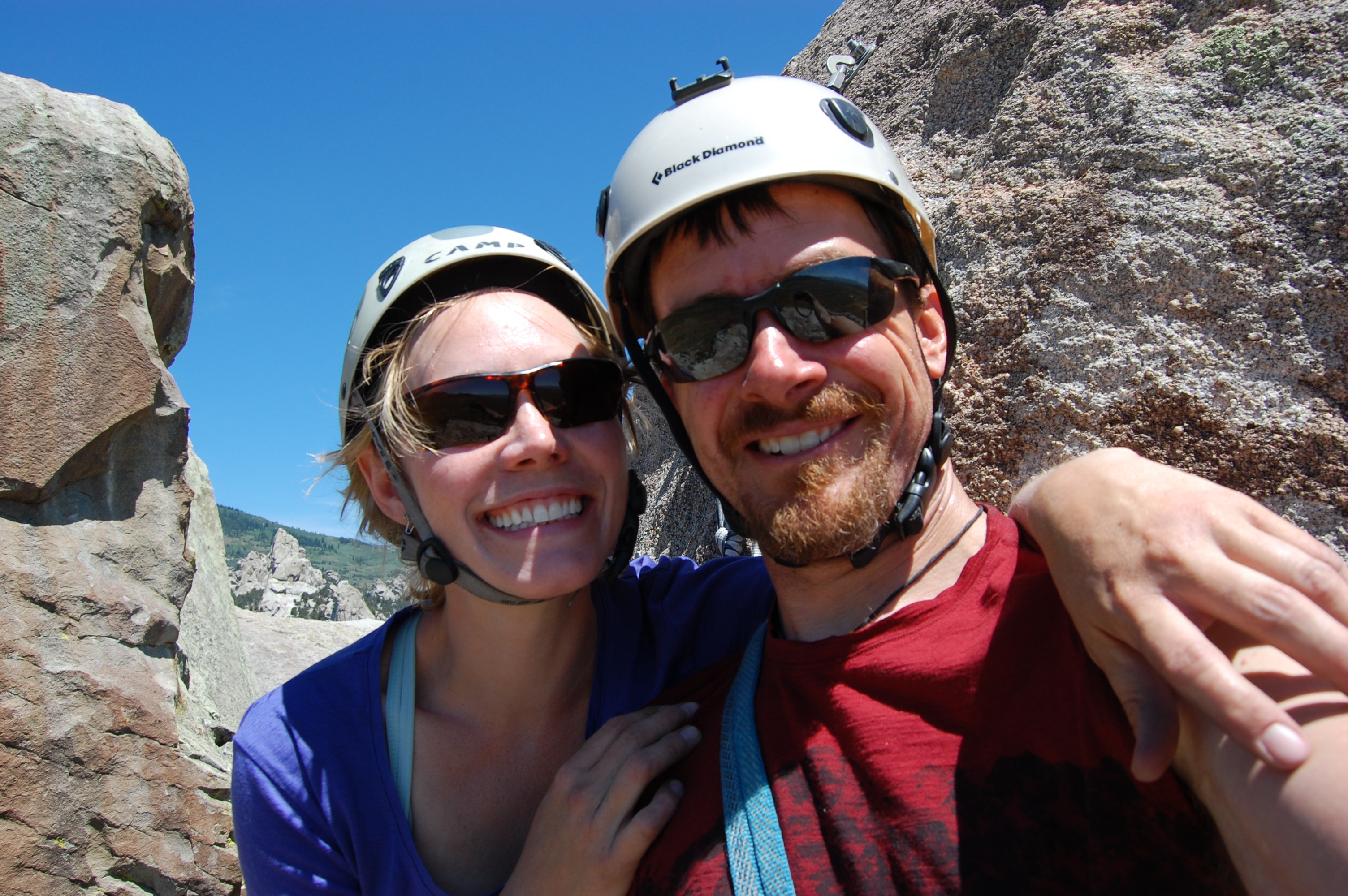 Jon and Rudie resting together on a ledge in Moab