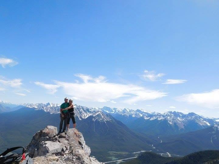 Two climbers celebrating on a summit